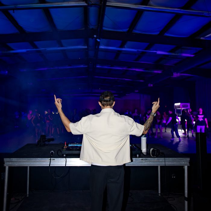 FLOTE performing at Lionheart, arms raised to the crowd